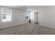 Spacious bedroom with neutral carpeting and large windows at 5846 Silver Moonlight Dr, Palmetto, FL 34221