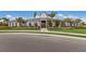 Community clubhouse with palm trees and landscaping at 5846 Silver Moonlight Dr, Palmetto, FL 34221