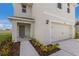 Two-story house with attached garage and walkway at 5846 Silver Moonlight Dr, Palmetto, FL 34221