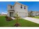 Two-story house with attached garage and landscaping at 5846 Silver Moonlight Dr, Palmetto, FL 34221