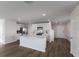Open concept kitchen with white cabinets and a large island at 5846 Silver Moonlight Dr, Palmetto, FL 34221