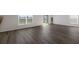 Living area with luxury vinyl flooring and large windows at 5846 Silver Moonlight Dr, Palmetto, FL 34221