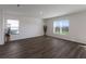 Spacious living room with luxury vinyl plank flooring and access to backyard at 5846 Silver Moonlight Dr, Palmetto, FL 34221