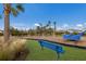 playground with swings and a spinning toy at 5846 Silver Moonlight Dr, Palmetto, FL 34221