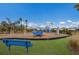 playground with swings, slides and a spinning toy at 5846 Silver Moonlight Dr, Palmetto, FL 34221