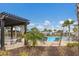 Resort-style pool with pergola and lounge chairs at 5846 Silver Moonlight Dr, Palmetto, FL 34221