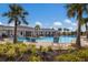 Resort-style pool with lounge chairs and shaded areas at 5846 Silver Moonlight Dr, Palmetto, FL 34221