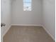Large walk-in closet with neutral carpeting and window at 5846 Silver Moonlight Dr, Palmetto, FL 34221