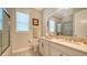 Clean bathroom with double vanity and granite countertop at 6337 Rivo Lakes Blvd, Sarasota, FL 34241