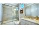 Bathroom with a shower/tub combo, granite countertop, and updated fixtures at 6337 Rivo Lakes Blvd, Sarasota, FL 34241