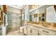Spa-like bathroom with granite vanity and large walk-in shower at 6337 Rivo Lakes Blvd, Sarasota, FL 34241