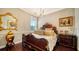 Charming bedroom with ornate bed frame and decorative accents at 6337 Rivo Lakes Blvd, Sarasota, FL 34241