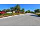 Community entrance with landscaping and signage at 6337 Rivo Lakes Blvd, Sarasota, FL 34241