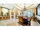 Formal dining area with decorative accents and hardwood floors at 6337 Rivo Lakes Blvd, Sarasota, FL 34241