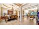 Elegant formal dining room featuring a chandelier and hardwood floors at 6337 Rivo Lakes Blvd, Sarasota, FL 34241