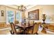 Bright dining room with large windows and decorative accents at 6337 Rivo Lakes Blvd, Sarasota, FL 34241