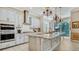 Updated kitchen with stainless steel appliances and granite countertops at 6337 Rivo Lakes Blvd, Sarasota, FL 34241