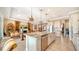 Modern kitchen with stainless steel appliances and granite island at 6337 Rivo Lakes Blvd, Sarasota, FL 34241