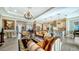 Bright and airy living room with high ceilings and lots of natural light at 6337 Rivo Lakes Blvd, Sarasota, FL 34241