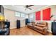 Relaxing media room with leather couch and large screen TV at 6337 Rivo Lakes Blvd, Sarasota, FL 34241