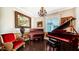 Music room with two grand pianos and hardwood floors at 6337 Rivo Lakes Blvd, Sarasota, FL 34241