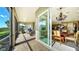 Screened patio with brick pavers, providing access to dining area at 6337 Rivo Lakes Blvd, Sarasota, FL 34241