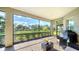 Spacious screened patio overlooking a lush backyard landscape at 6337 Rivo Lakes Blvd, Sarasota, FL 34241
