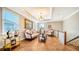 Upstairs sitting area features hardwood floors and comfy seating at 6337 Rivo Lakes Blvd, Sarasota, FL 34241