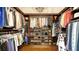 Large walk-in closet with ample hanging space and shelving at 6337 Rivo Lakes Blvd, Sarasota, FL 34241