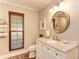 Elegant bathroom with granite countertop and large mirror at 6706 22Nd W Ave, Bradenton, FL 34209