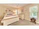 Light and airy bedroom with a dresser and large window at 6706 22Nd W Ave, Bradenton, FL 34209