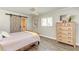 Comfortable bedroom with sliding barn door and wood floors at 6706 22Nd W Ave, Bradenton, FL 34209