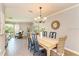 Elegant dining room with a wooden table and chandelier at 6706 22Nd W Ave, Bradenton, FL 34209