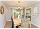 Bright dining room features a large table, chandelier, and access to the backyard at 6706 22Nd W Ave, Bradenton, FL 34209