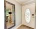 Inviting entryway with a large mirror and elegant front door at 6706 22Nd W Ave, Bradenton, FL 34209