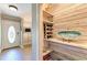 Inviting entryway with built-in shelving and wine storage at 6706 22Nd W Ave, Bradenton, FL 34209
