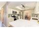 Updated kitchen with white cabinets and a large island at 6706 22Nd W Ave, Bradenton, FL 34209