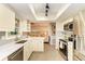 Modern kitchen with stainless steel appliances and stylish backsplash at 6706 22Nd W Ave, Bradenton, FL 34209