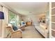Light-filled living room features comfortable seating and views of the backyard at 6706 22Nd W Ave, Bradenton, FL 34209
