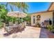 Outdoor patio with dining set, umbrella, and grill at 6706 22Nd W Ave, Bradenton, FL 34209