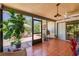 Spacious screened porch with terracotta tile floor and ceiling fan at 6706 22Nd W Ave, Bradenton, FL 34209
