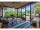Relaxing sunroom with wicker furniture and access to the backyard at 6706 22Nd W Ave, Bradenton, FL 34209