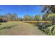 Enjoy the pond view from this grassy backyard at 7121 Victoria Cir, University Park, FL 34201