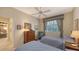 Well-lit bedroom with twin beds and access to another room at 7121 Victoria Cir, University Park, FL 34201