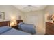 Charming bedroom with twin beds and a ceiling fan at 7121 Victoria Cir, University Park, FL 34201