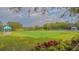 Relaxing croquet court with beautiful landscaping at 7121 Victoria Cir, University Park, FL 34201