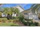 Landscaped house exterior featuring lush greenery at 7121 Victoria Cir, University Park, FL 34201