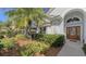 Front entrance with walkway and mature landscaping at 7121 Victoria Cir, University Park, FL 34201