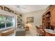 Bright home office features built-in shelves, window seat, and comfortable seating at 7121 Victoria Cir, University Park, FL 34201