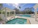 Relaxing hot tub area with pergola and comfortable seating at 7121 Victoria Cir, University Park, FL 34201